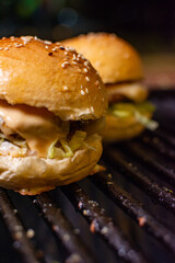 Burger with melted cheese, made on the grill

