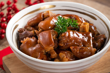 Taiwanese traditional food pork knuckle in a bowl for Chinese Lunar New Year meal.