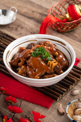 Taiwanese traditional food pork knuckle in a bowl for Chinese Lunar New Year meal.