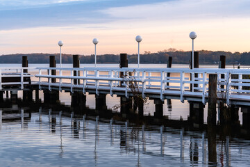 Fototapeta premium Photos of a picturesque autumn park on the lake in Lower Saxony, Germany. Dawn in the park.