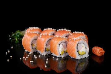 Fresh mouth-watering sushi with salmon and mango philadelphia cheese prepared in a Japanese restaurant.