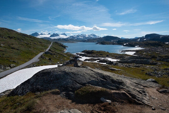 Snow capped mountains and crystal clear lakes along the Sognefjellsvegen, highest mountain road of Northern Europe, Jotunheimen National Park, Norway