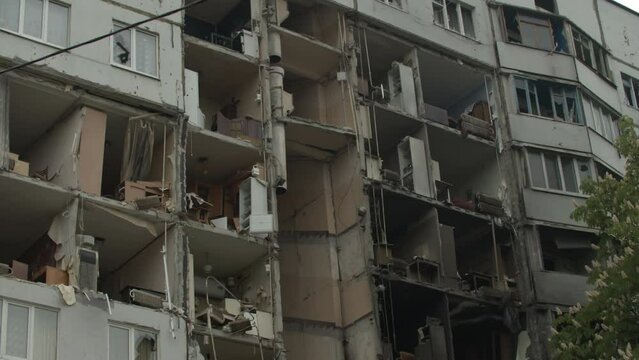 Collapsed block of flats, result of russian missile attack on Ukrainian citizens. Residential building with no walls, large holes in apartments caused by russian rockets. Kharkiv 25.05.2022