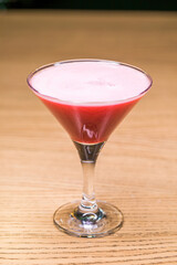 Alcoholic cocktail on wooden board