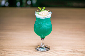 Alcoholic cocktail on wooden board