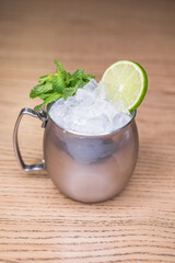 Alcoholic cocktail on wooden board