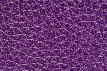 Purple artificial or synthetic leather background with neat texture and copy space