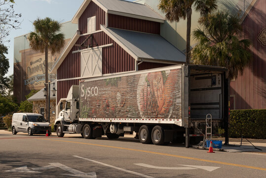 The Villages, Florida, USA. 2022. Food Service Delivery Truck With Tailgate Open During Deliveries In A Florida Town.