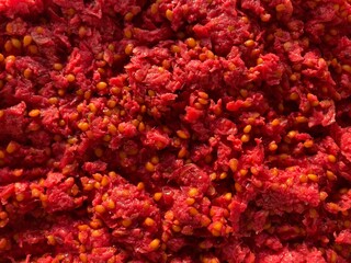 a red pulp speckled with yellow seeds
