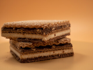 Crispy waffles with cocoa cream and nuts. Wafers with chocolate and nuts.