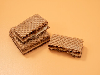Crispy waffles with cocoa cream and nuts. Wafers with chocolate and nuts.