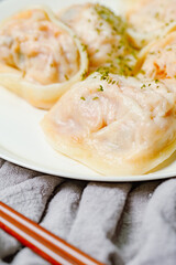 kimchimandu, Korean Kimchi dumpling : Kimchi dumplings are stuffed with a filling of chopped kimchi, bean curd, and vegetables. They are the most popular type of dumpling among Koreans.