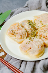 kimchimandu, Korean Kimchi dumpling : Kimchi dumplings are stuffed with a filling of chopped kimchi, bean curd, and vegetables. They are the most popular type of dumpling among Koreans.