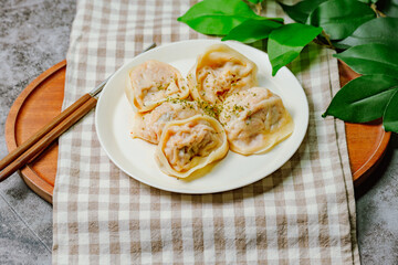 kimchimandu, Korean Kimchi dumpling : Kimchi dumplings are stuffed with a filling of chopped kimchi, bean curd, and vegetables. They are the most popular type of dumpling among Koreans.