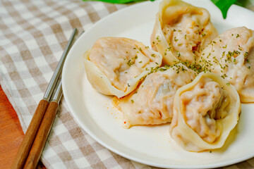 kimchimandu, Korean Kimchi dumpling : Kimchi dumplings are stuffed with a filling of chopped kimchi, bean curd, and vegetables. They are the most popular type of dumpling among Koreans.
