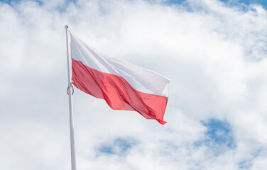 flag political poland against the background of the sky and clouds