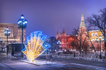 New Year and the Kremlin on a winter night and a fan of lights, Moscow