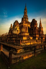 Fototapeta premium Wat Mahathat The old temple in Thai history, it is one of the most important and famous ancient sites and historical parks in Sukhothai Province, Thailand
