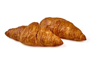 Freshly baked croissants, isolated on white background.