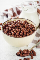 sweet crunchy chocolate children's breakfast chocolate balls on a white background