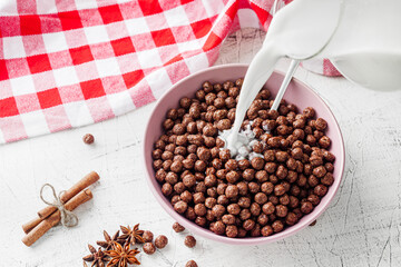 sweet crunchy chocolate children's breakfast chocolate balls on a white background