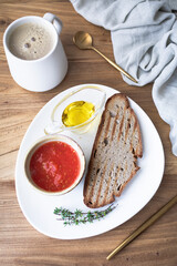 Healthy breakfast, bread with olive oil and tomato and coffee