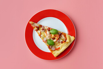 A piece of delicious homemade pizza on a plate on a pink background, close-up.