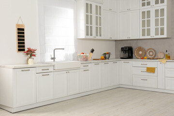 Beautiful kitchen interior with stylish modern furniture