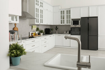 Beautiful kitchen interior with stylish modern furniture