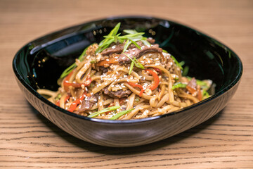 Restaurant dish homemade noodles with meat.