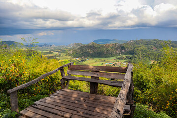 Fototapeta na wymiar Mountain view on wooden balcony on the mountain.
