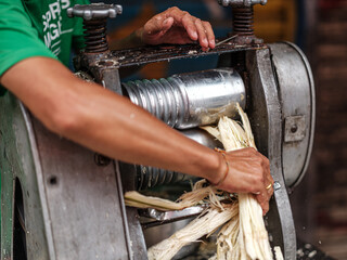 Processing sugar cane drink on the street