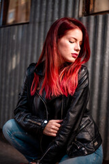 Young beautiful red hair woman wearing casual clothing on the street. Female fashion model red hair.