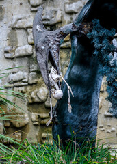 A flying pterosaur attraction with a human skeleton in front of an attraction in Sochi Park © Sergey