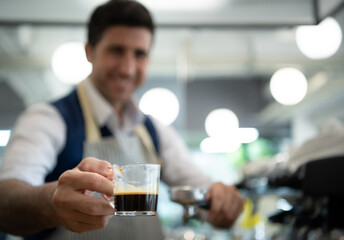 Coffee expert barista Making hot Americano for customers