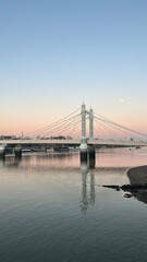 Fototapeta na wymiar Sunset over Prince Albert Bridge with moon and Thames river