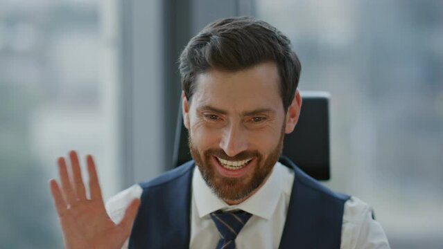 Coach talking video meeting in office close up. Manager saying goodbye online.