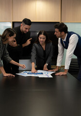 New business people in the conference room are exchanging information with each other along with...
