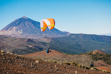 Paragliding in Tenerife from the volcano through the clouds. Teide