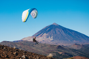 Paragliding in Tenerife from the volcano through the clouds. Teide