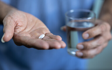 person taking pills, Taking medication to treat illness