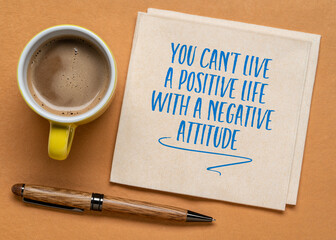 you can't live a positive life with a negative attitude - inspirational handwriting on a napkin,...