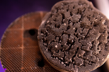 Used, destroyed, with deformation. Filter of harmful emissions, catalyst from the vehicle. detail close up view. Material containing precious metals. Muffler of the exhaust system.