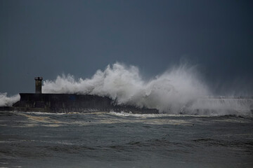 Fototapeta na wymiar Harbor wall under storm