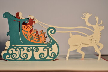 pop up Christmas card with Santa and a reindeer