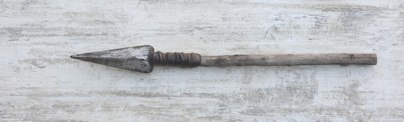 viking spear on white wooden background