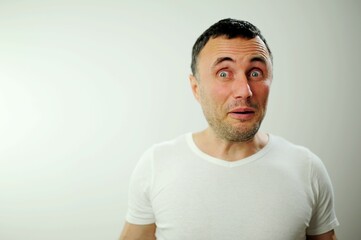 Fototapeta premium Portrait of man surprised face expression Surprised male hipster, keeps mouth opened, being stupefied as advertises something, Omg concept shouting WOW with copy space fot your text. Shock content