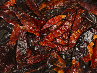 dried red chili peppers close-up background