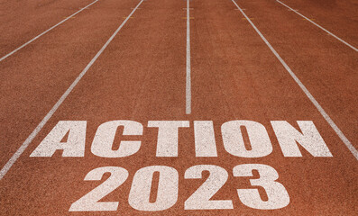 Fototapeta na wymiar Action 2023 written on running track, New Concept on running track text in white colour