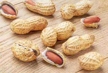 Peanut. A pod of peanut beans. Close-up. On a wooden table.